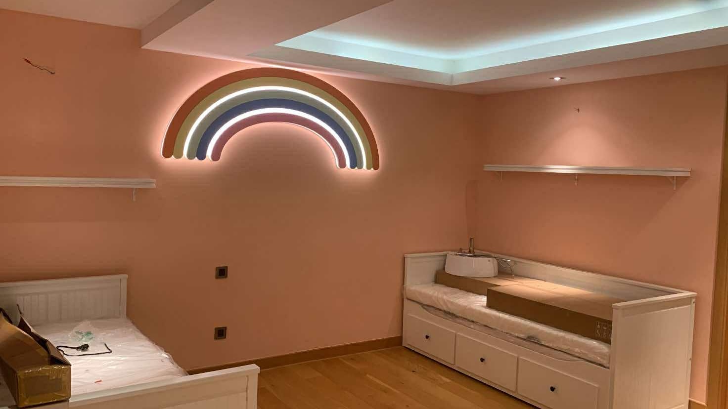 Girls' room with rainbow neon wall art