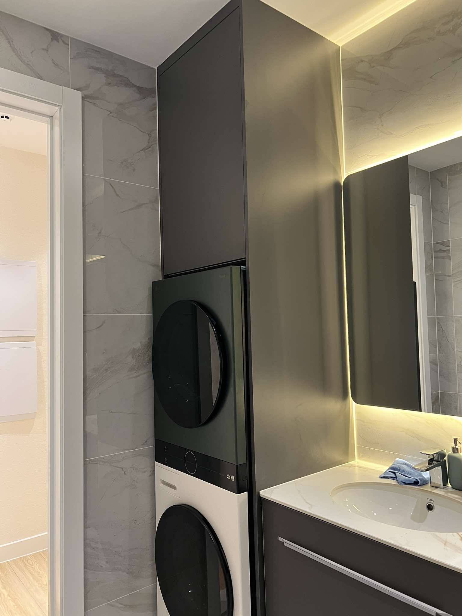 Bathroom cabinet with stacked washer-dryer and mirror