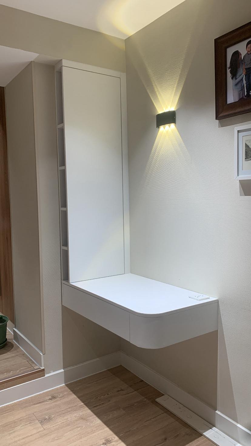 Floating console with wall cabinet and warm sconce