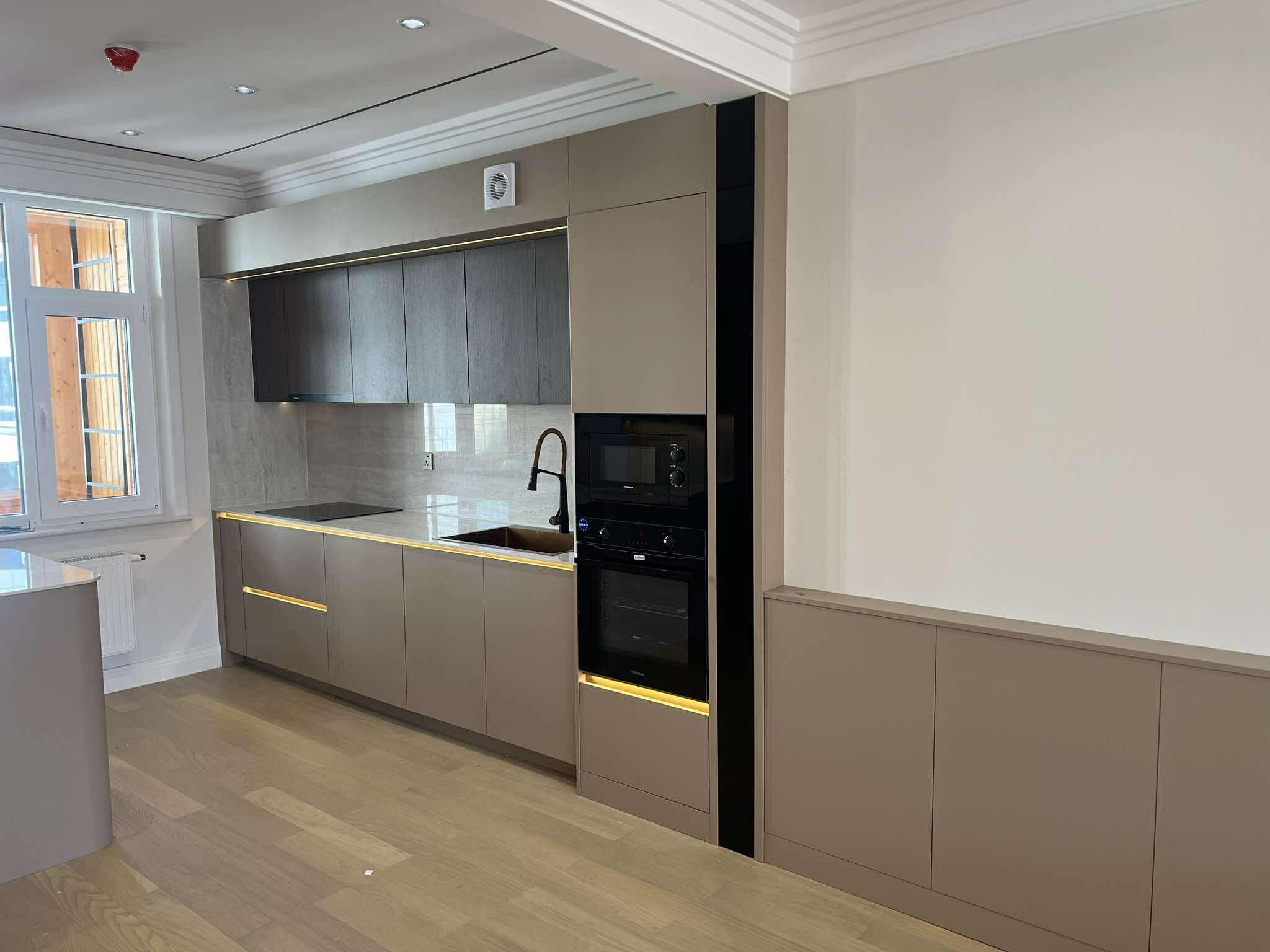 Earthy kitchen with gold drawer handles