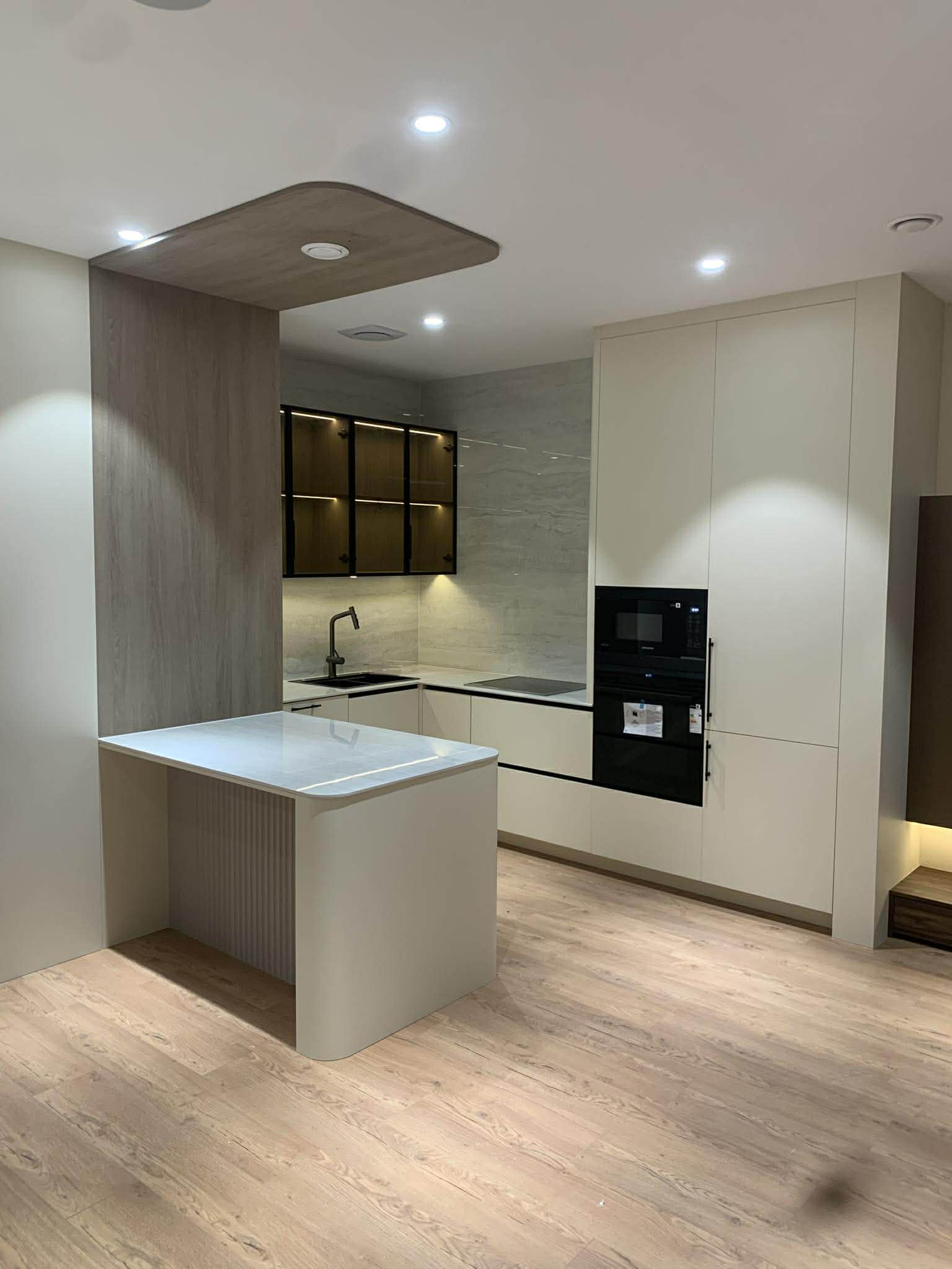 Kitchen with wooden column and glass tower cabinet