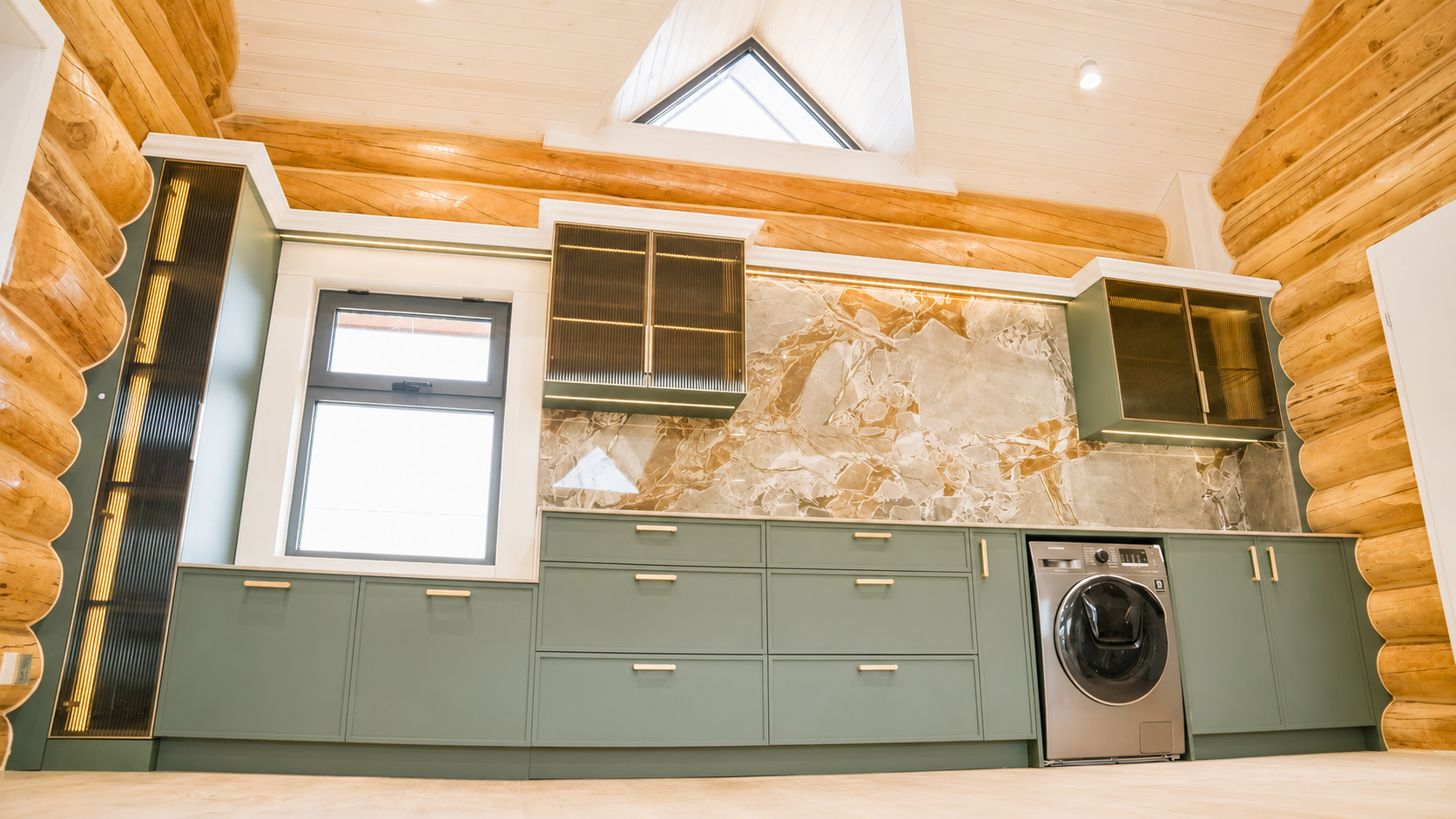 White kitchen with wood backsplash and linear LED lighting
