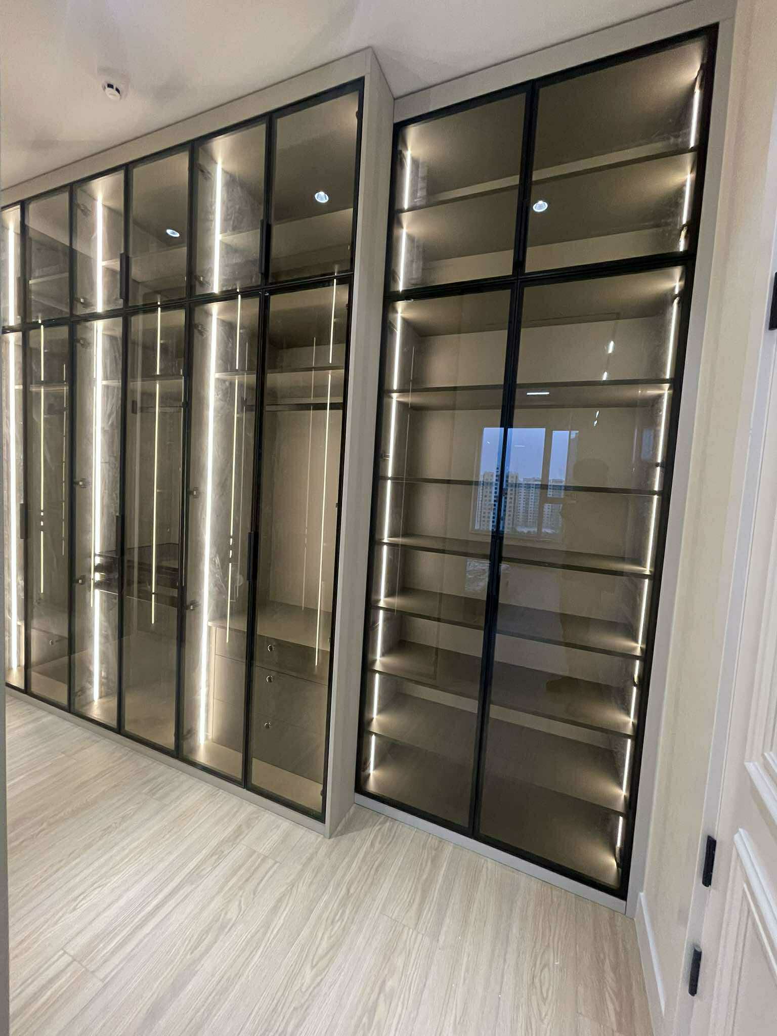Elegant glass-door wardrobe with bronze frame