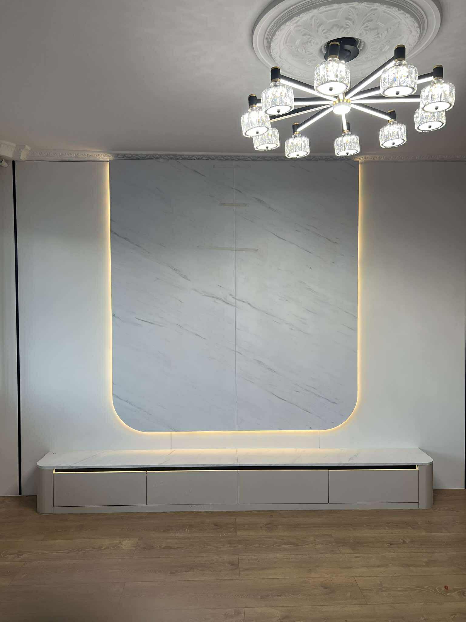 Grey textured TV backdrop with backlit recess