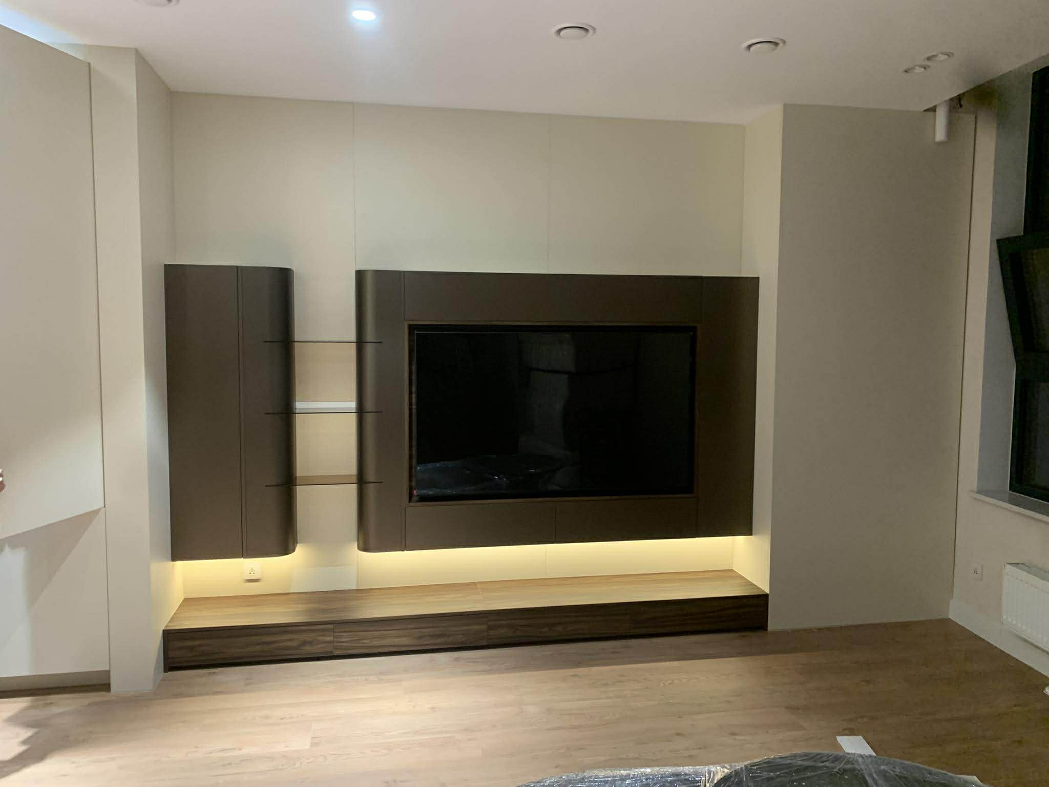 Contemporary TV unit with dark panel surround